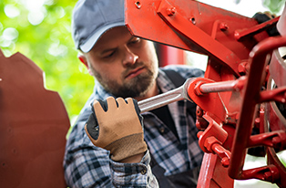 Man working on tractor