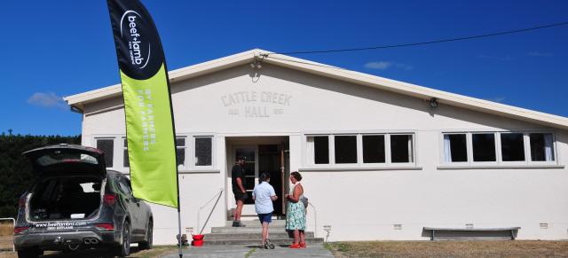 image of people outside meeting hall