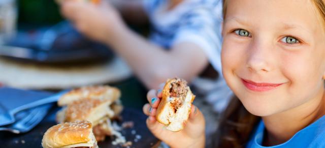 girl eating burger