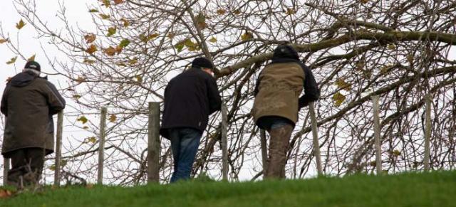 image of farmers at fence