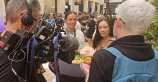 image of athletes and media at Paris Olympics