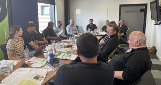 image of farmer council around table planning