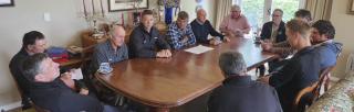 farmers talking around a table