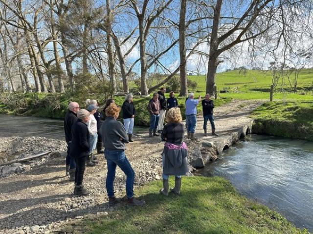 image of catchment group members by lake