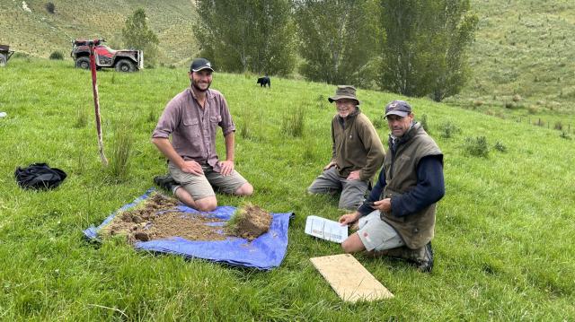 image of research group on farm sampling soil