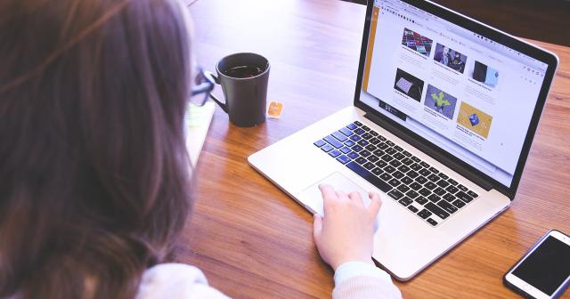 image of female farmer at laptop