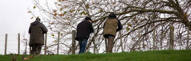 image of farmers at fence